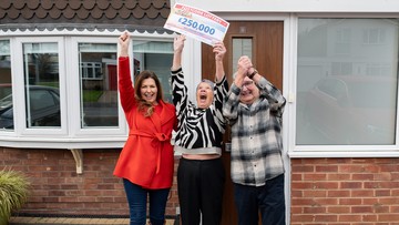 CHEQUE IT OUT: Judie celebrates with Bev and Andy