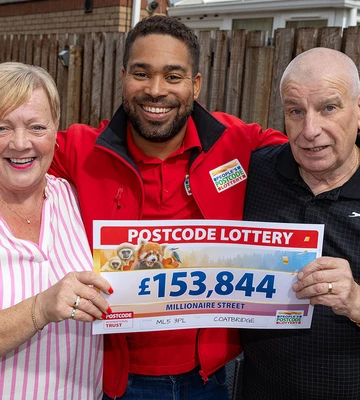 MAY THE FOURS BE WITH YOU: Geraldine and hubby Paul with lottery presenter Danyl Johnson