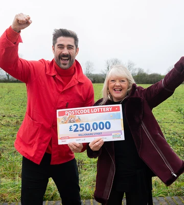 SPECIAL DELIVERY: Carol's joy at win, presented by ambassador Matt Johnson