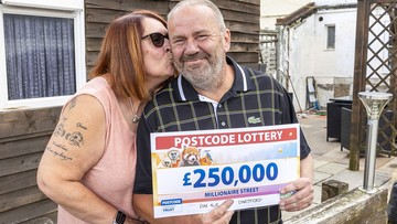 THIS'LL COME IN ANDY: Millionaire Street winners Andy and Helen celebrating
