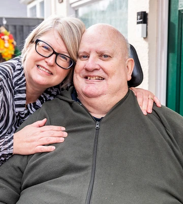 HUG OF LOVE: Steven and wife Lynn have plans to spend their win