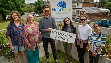 MAKING HEADWAY: Charity team celebrate award
