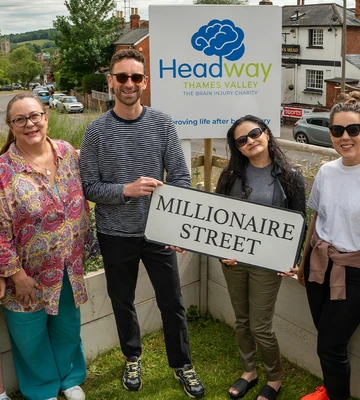 MAKING HEADWAY: Charity team celebrate award