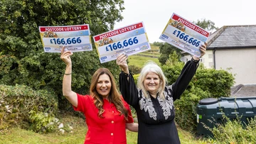 Judie and Catherine celebrating a triple win
