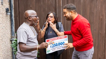 Tony and Tracey get the first of two cheques from Danyl Johnson.