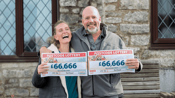 The cheery couple with cheques for an incredible combined winnings of £133,332