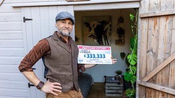 SHED-LOAD OF CASH: James celebrates win in his man cave