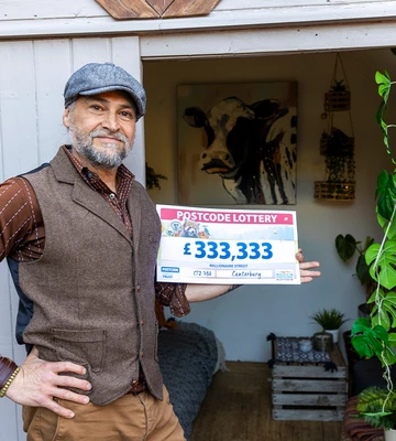 SHED-LOAD OF CASH: James celebrates win in his man cave