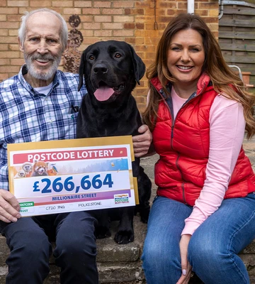 WON MAN AND HIS DOG: Malcolm celebrates quadruple windfall