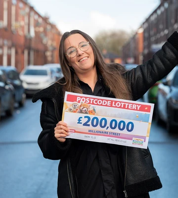 CHEQUE IT OUT: Buzzing Beth always said she'd land a Postcode Lottery win