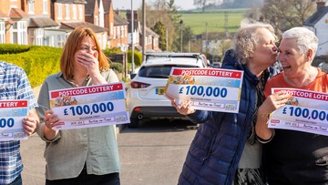 WINNING TOGETHER: Karen gives Jane a kiss on the cheek after a £100k surprise