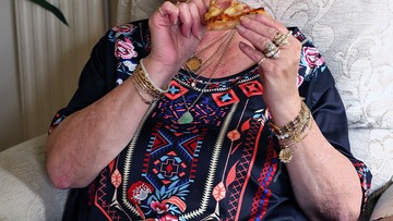 NICE SLICE: Suzanne celebrates by tucking into her favourite ham and pineapple pizza