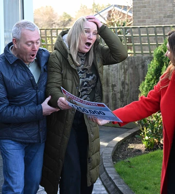 LOTT TO TAKE IN: Lesley and Robin stunned as Lottery's Judie McCourt reveals win