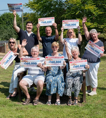 CHEQUE US OUT!: Villagers pose before starting celebrations