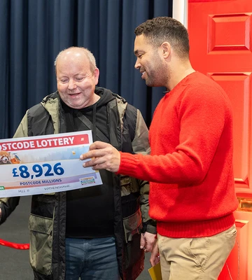 LATE WINNER: Danyl presented Chris with a cheque when he turned up last