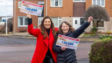 GRIN THE MONEY: Carol's laughing all the way to the bank