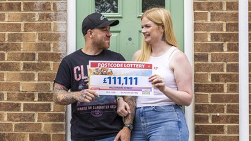 HOUSE ABOUT THAT! Christina and hubby Matthew outside winning address