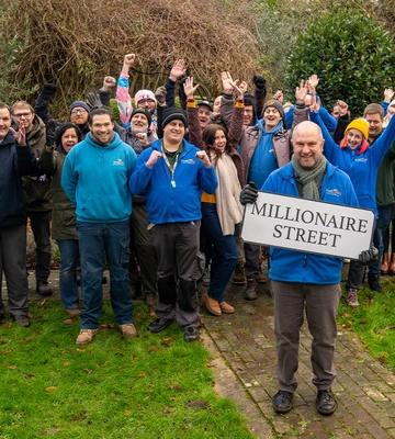 TRANSFORMING LIVES: Trust Links CEO Matt King celebrates with volunteers and members