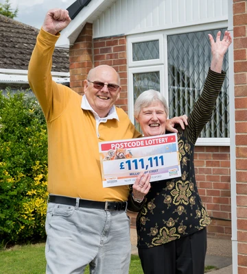 Geoffrey and wife Jenny celebrate after his £111,111 win