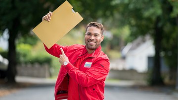 Presenter Danyl Johnson poses with our signature golden envelope