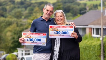 HUGGY PAIR: Julie and Carl landed a cheque each