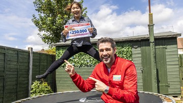 BOUNCING CHEQUE: Winner Yu is jumping for joy after picking up a £250,000 prize