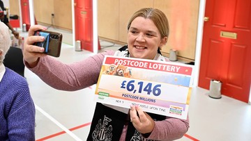 SELFIE CHEQUE: Zoe Dodds poses with cheeses at her windfall