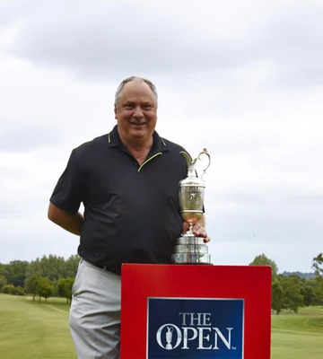 ACE FOR ERNIE: Giddy golf pro Ernie poses with the Claret Jug