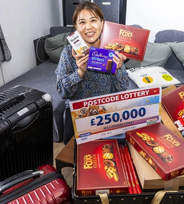 TAKES THE BISCUIT: Yu packs up treats for family in China