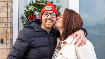 MERRY KISSMAS: Delighted Luke gets a peck on the cheek from his mum after his win