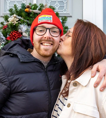 MERRY KISSMAS: Delighted Luke gets a peck on the cheek from his mum after his win