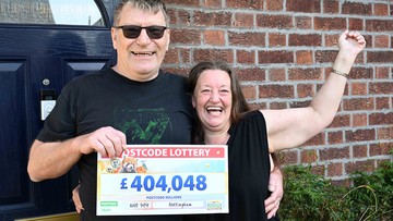 Winner Garry and wife Lesley struggle to take in the size of their cheque