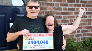Winner Garry and wife Lesley struggle to take in the size of their cheque