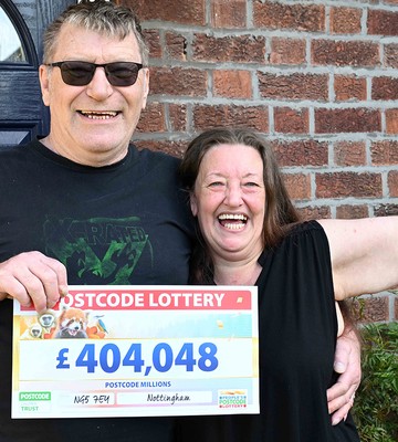 Winner Garry and wife Lesley struggle to take in the size of their cheque