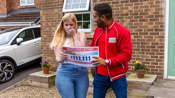 SHOCKED: Christina can't believe amount on cheque presented by presenter Danyl Johnson