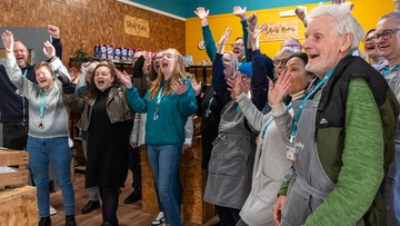 FRUITFUL FUNDING: Staff and volunteers of Community Grocery shop cheer at £75k boost