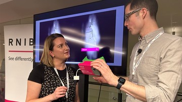 Making a difference: RNIB's Jim Sanders demonstrates Eyeware to Hazel Johnstone, Long-term Partnerships Manager at People's Postcode Lottery