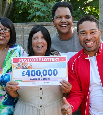 L-R Catherine, Celestina and Jack celebrating with Presenter Danyl Johnson