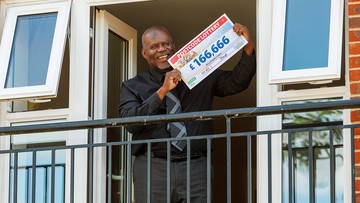 Ucal poses from his first floor flat