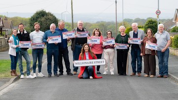 STREET PAVED WITH GOLD: Winning neighbours join Judie for a knees-up