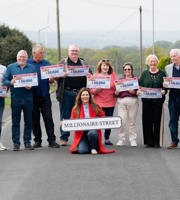 STREET PAVED WITH GOLD: Winning neighbours join Judie for a knees-up