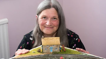 HOME SWEET HOME: Sally with model of dream cottage she'd love