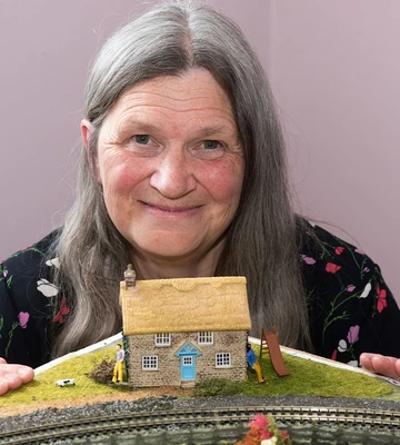 HOME SWEET HOME: Sally with model of dream cottage she'd love