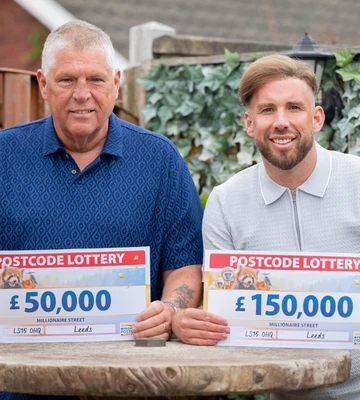 CHEQUE MATES: Philip and son James with their winnings