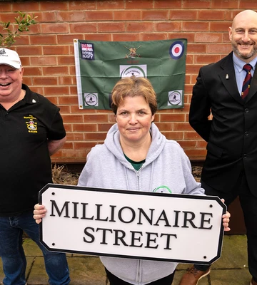 CHARITY JOY: Kerry with trustee Craig Barrington (R) and beneficiary Gary Whillock (L)