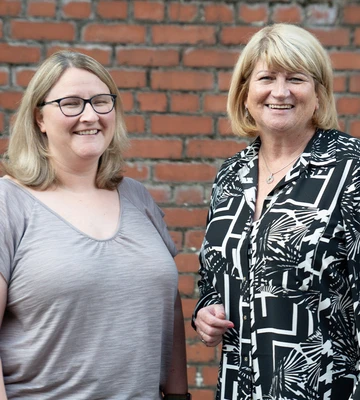 CHARITY NEIGHBOURS: Delighted Sylvia McPhillips of Deaf Services Lanarkshire (left), and Marian Tobin of Coatbridge CAB (right)