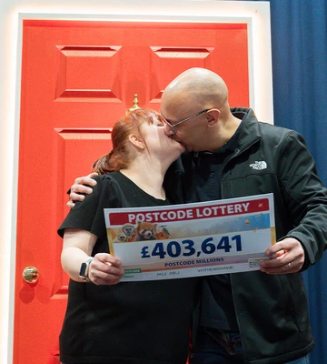 KISS AND MADE UP: Happy couple Michelle and Brett celebrate their win