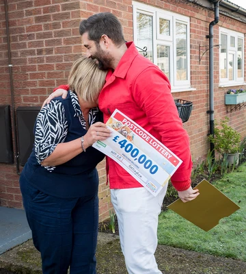 OVERWHELMING: Mandy sobs in the arms of Lottery's Matt Johnson