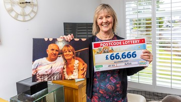 PENNIES FROM HEAVEN: Aileen with a picture of her and her late husband