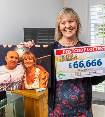 PENNIES FROM HEAVEN: Aileen with a picture of her and her late husband